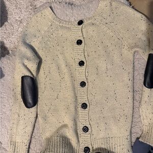 Sweater with buttons on the back